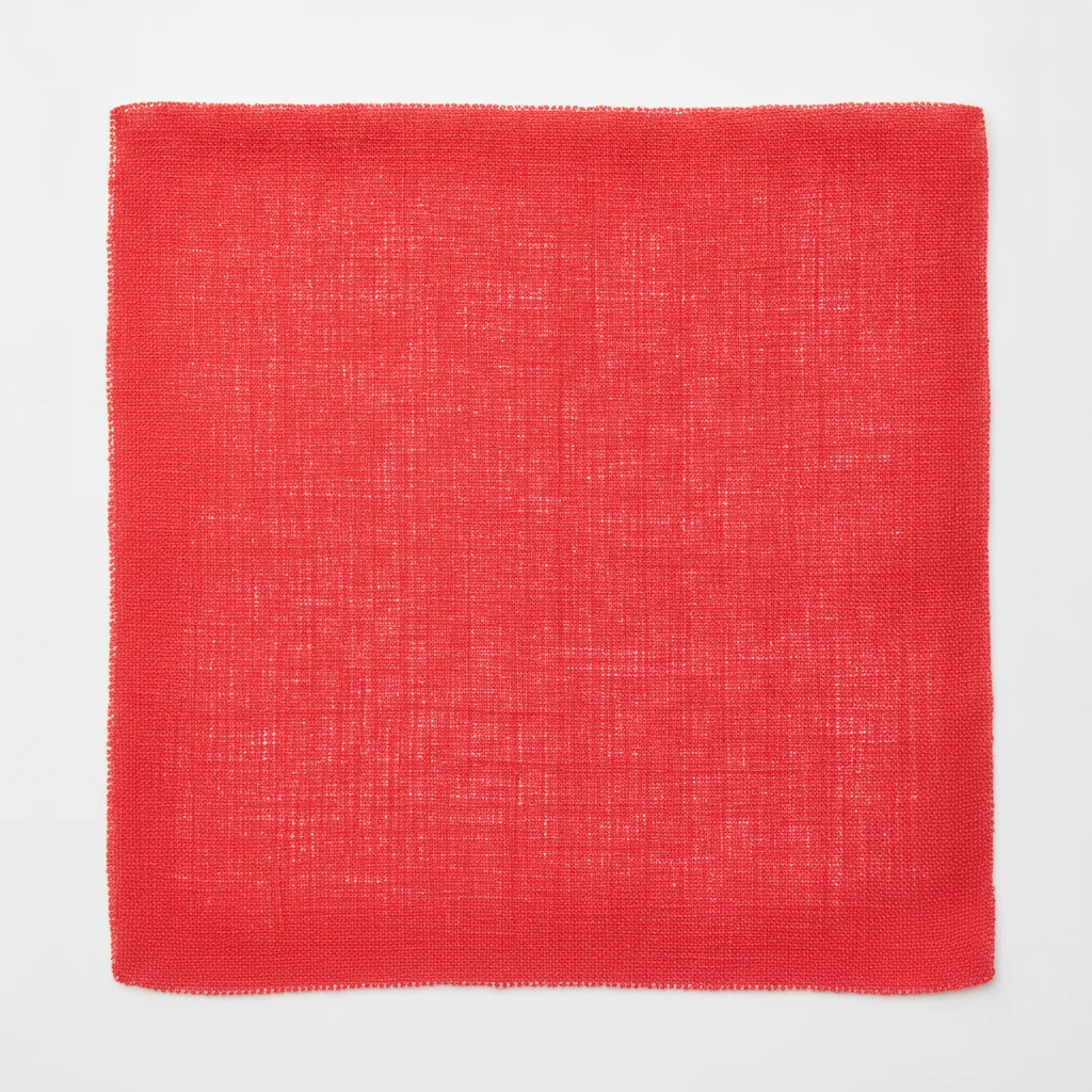 Bright red linen fabric swatch with visible weave texture on white background