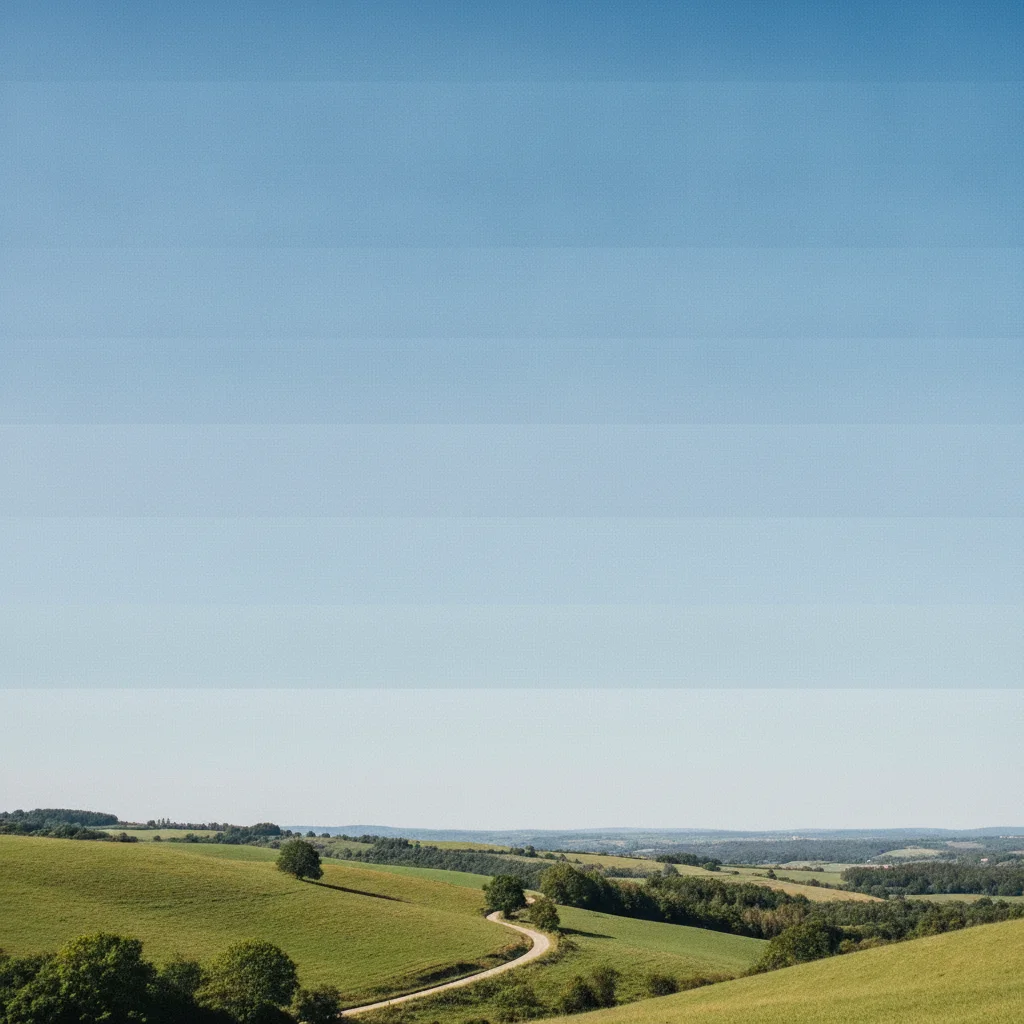 Same landscape with smooth natural sky gradient after JPEG banding removal