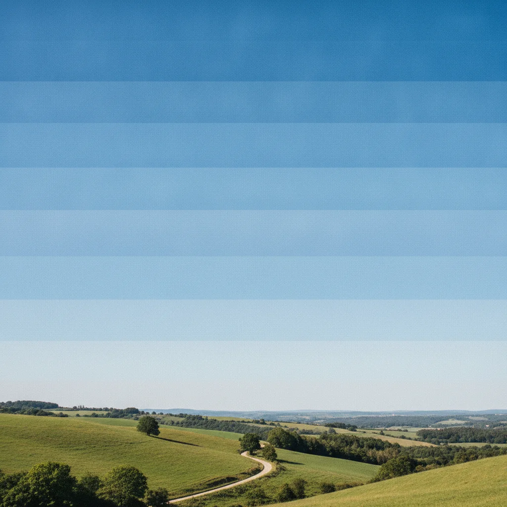 Landscape with visible JPEG banding in the sky — discrete tonal bands instead of smooth gradient