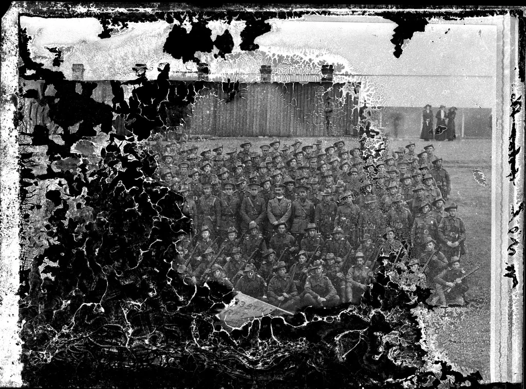 Before: group photo with severe damage - unedited source photograph (Public domain)