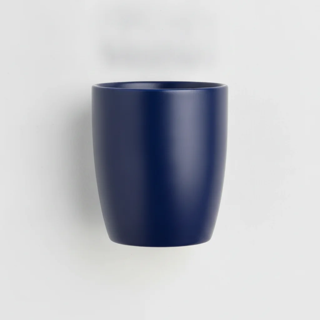 Same mug with price sticker removed and dark ceramic surface restored cleanly