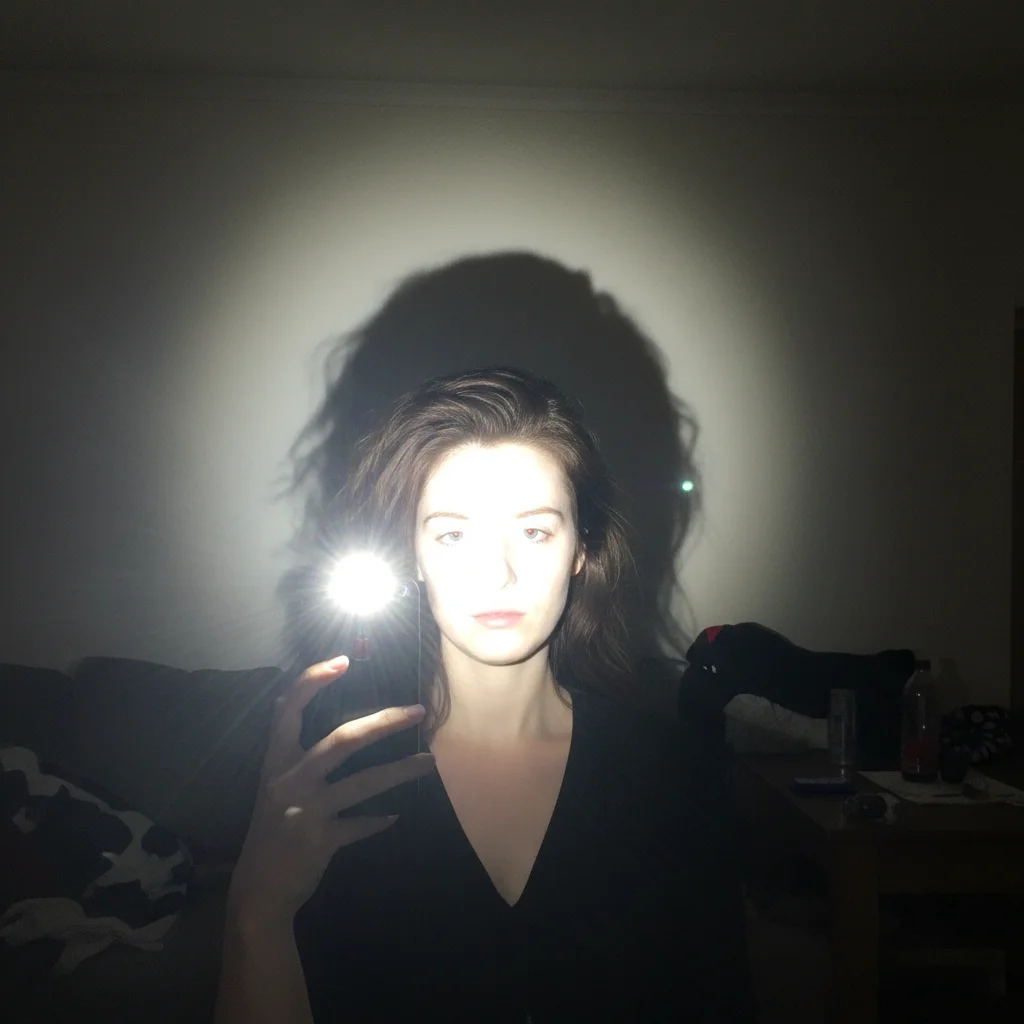 Selfie with harsh direct phone flash, washed out and flat