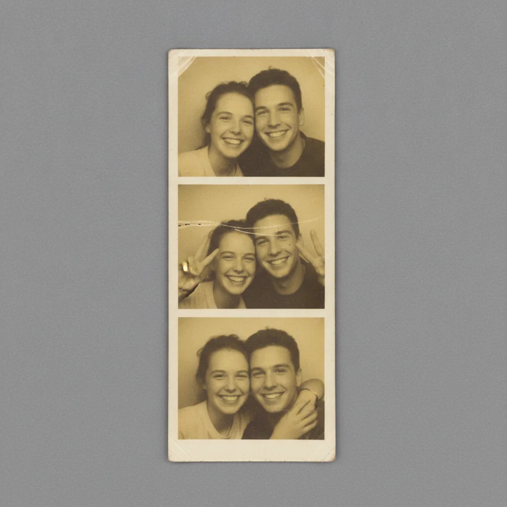 1990s photobooth strip with three frames, heavy yellow-brown discoloration, faded faces barely visible, horizontal scratches