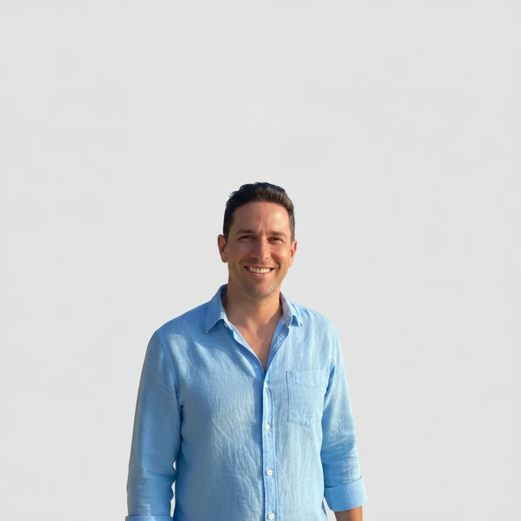Same man with the resort background replaced by a plain uniform gray background