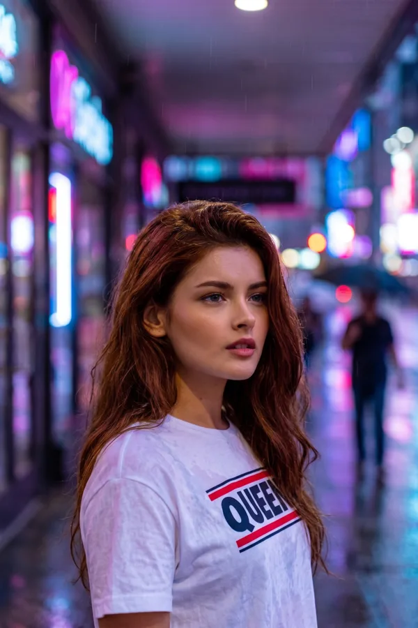 The same person on a neon city street at night